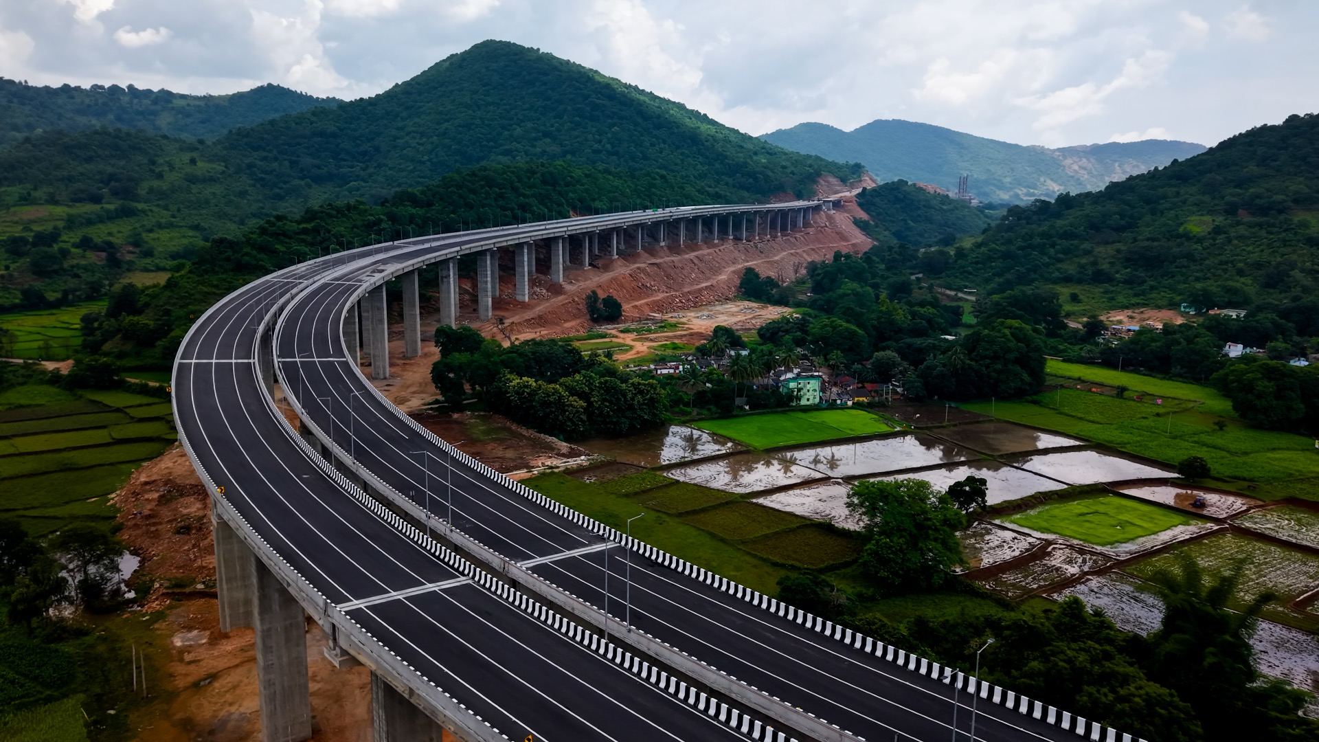 Six-lane elevated highway curving through mountains, NH-130-CD Odisha