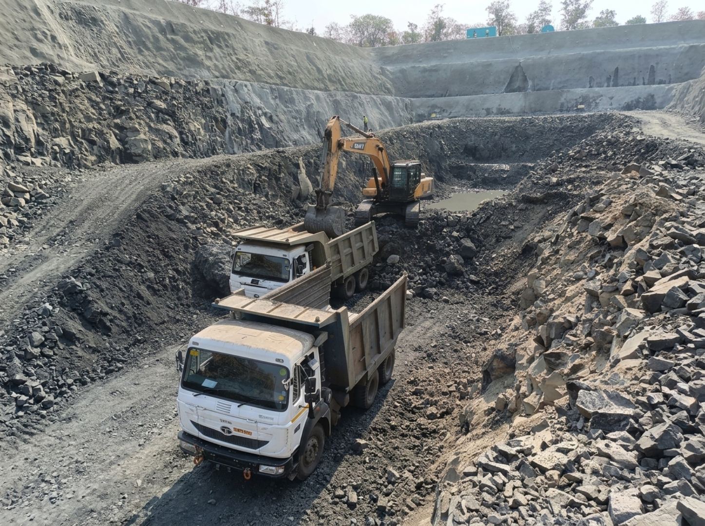 Excavation with dump trucks at Yavatmal-Nanded Railway site